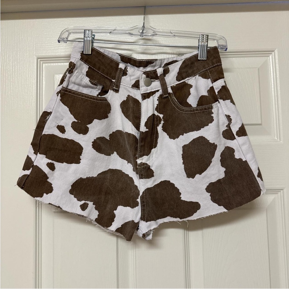 Brown and white cow print denim shorts